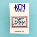 KCN Don't Postpone Joy Needle Minder